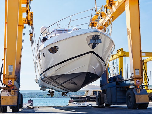 boat getting lifted for dry storage stack